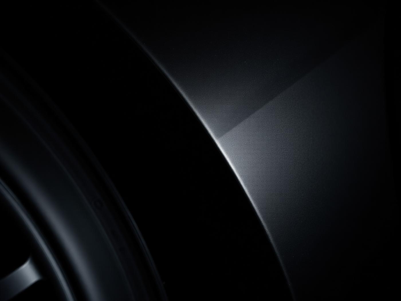 Macro detail of a body panel curve and alloy wheel